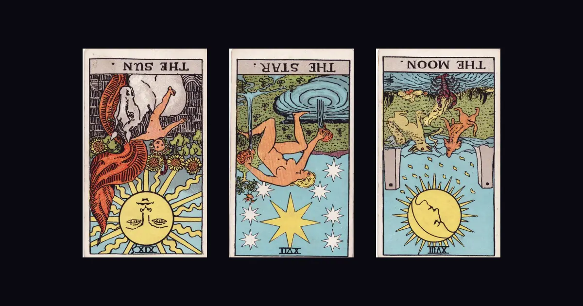 The Sun, the Star and the Moon from the Rider–Waite–Smith deck, all three upside down.