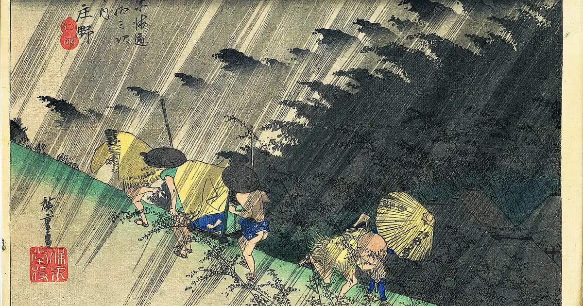 Hiroshige's print of Shono in a driving rain: palanquin bearers and travellers hunched and hurrying under slanting rain, bamboo bending in the wind.